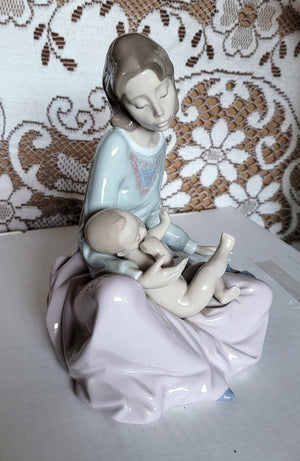 Lladro #5845 Dressing the Baby
