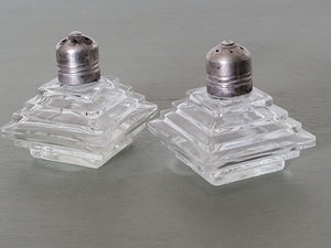 Set of vintage glass salt and pepper shakers with sterling caps