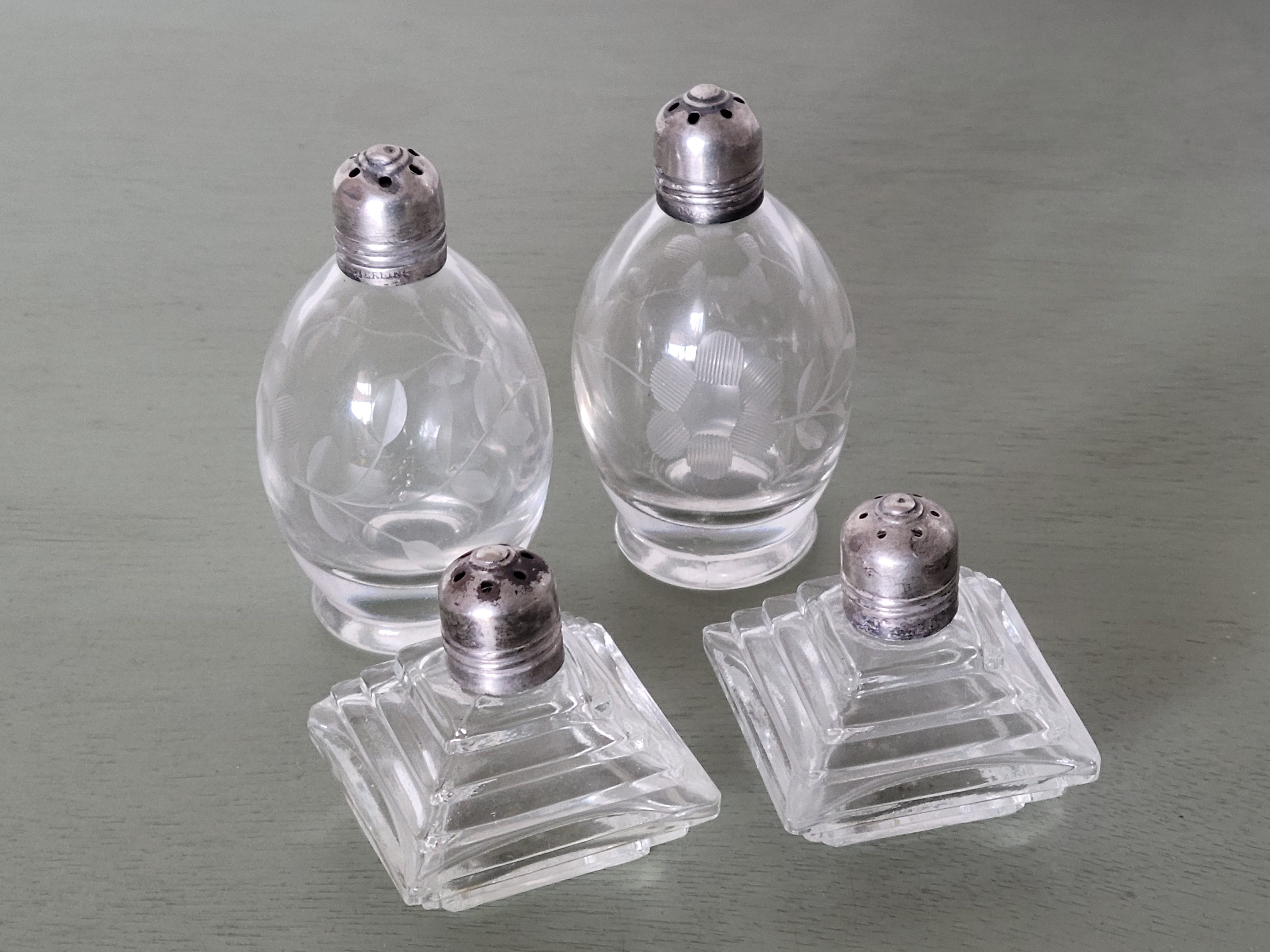Set of vintage glass salt and pepper shakers with sterling caps